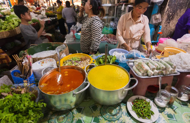 Local food market stand serves absolutely perfect food for you to relish Cambodian dishes.