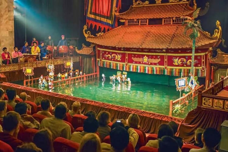 Tourists are enjoying a water puppet show