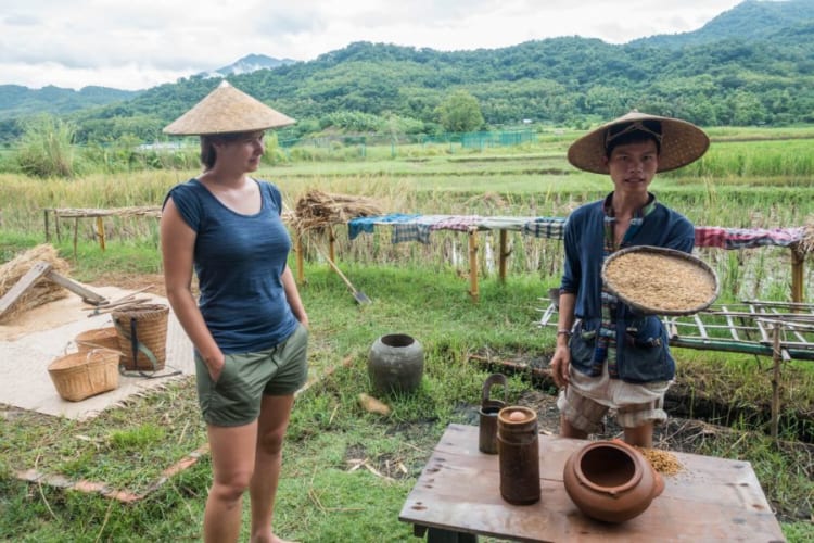 Tourists are learning about agricultural products in Laos.