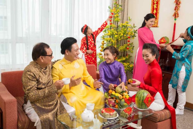 Traditional Vietnamese Family wearing Ao Dai together in Tet Holiday