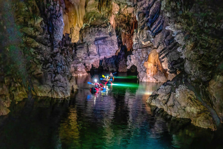 Tourists explore Phong Nha cave on boats