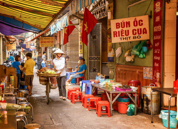 A common scene of the locals eating at a food stall in Ho Chi Minh City.