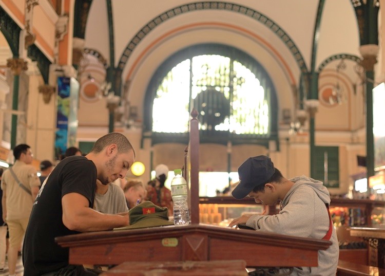 Tourists and local people come to write and send letters.