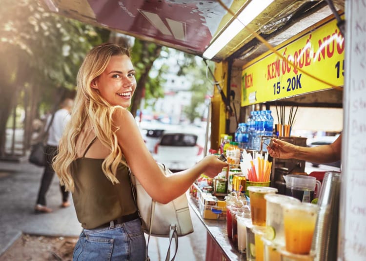 Visitors experiencing Vietnam local street food