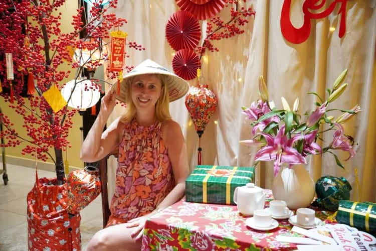 A female Polish visitor poses photos with Tet decoration in Ho Chi Minh City’s restaurants