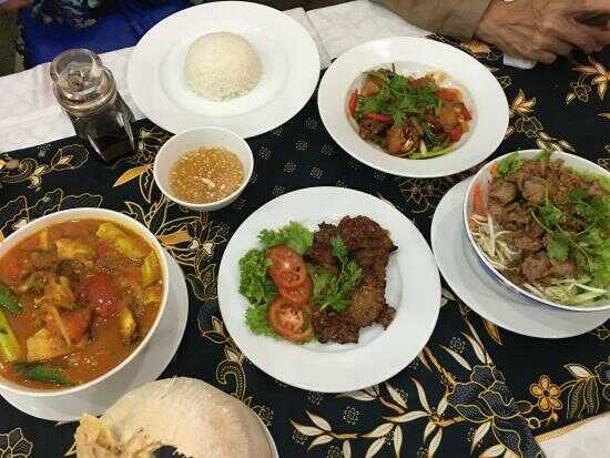 Famous Tom Yam Seafood (on the left side) and Thai Mango Kerabu (on the right side) at Serai Restaurant