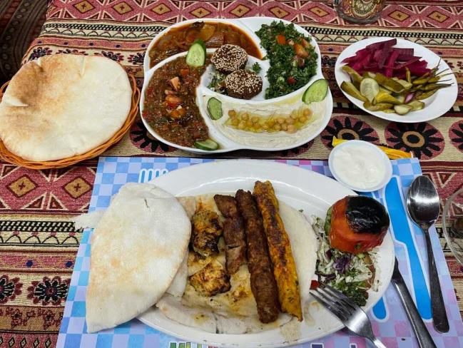 Grilled meat with pitta breads served at Al-Sham