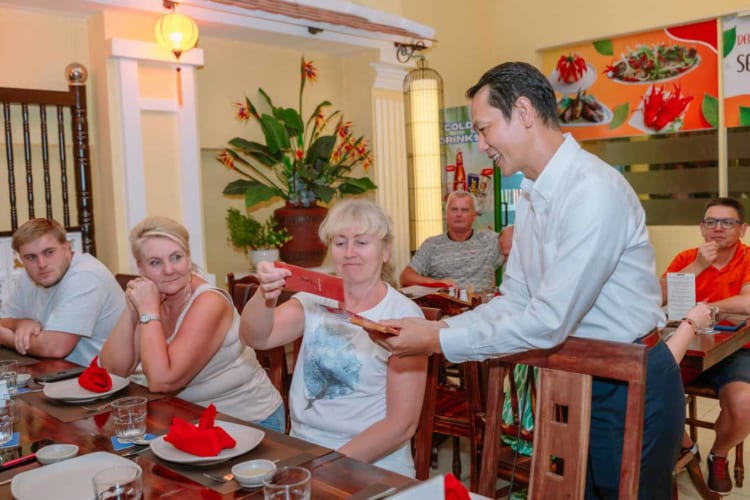 Polish visitors happily received lucky money in red envelopes during Tet