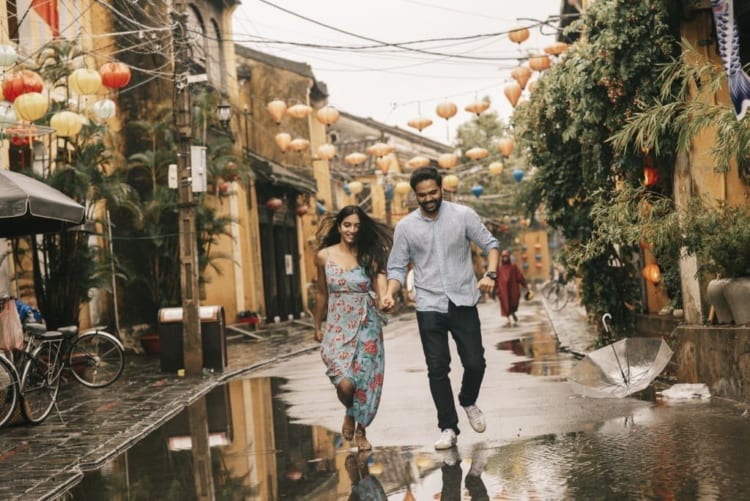 couple scrolling through Hoi An ancient town