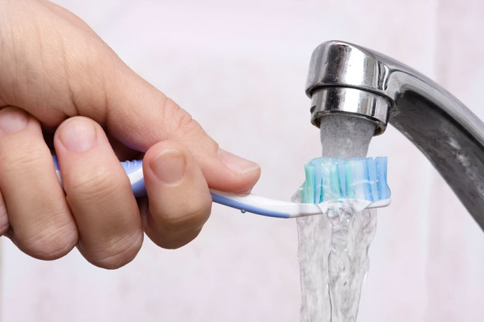 Brushing teeth with tap water