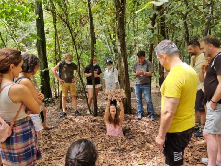 tourists exploring Cu Chi Tunnels