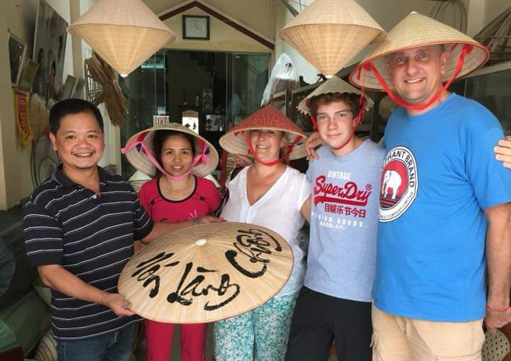 Tourists visit a non la making village and receive a gift