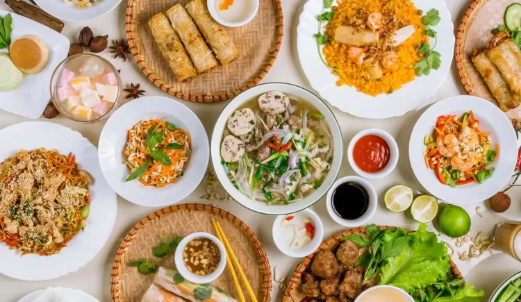 a table with full of vietnamese foods - unskippable part of things to do in vietnam