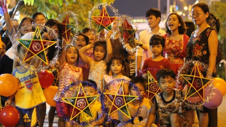 Vietnamese children enormously enjoying the atmosphere of Mid-Autumn Festival