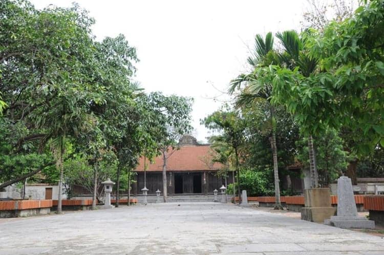 Lua Viet Tours traditional Vietnamese temple with lush greenery and historical architecture.