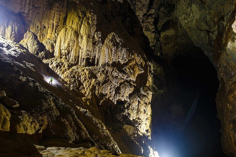 Son Doong Cave Tour travelers climbing the Great Wall of Vietnam inside Son Doong Cave